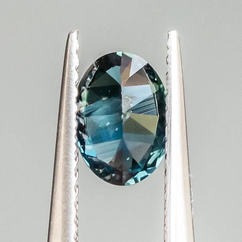 0.93CT OVAL NIGERIAN SAPPHIRE, TEAL BLUE, 7.01X5.04X3.40MM, UNTREATED