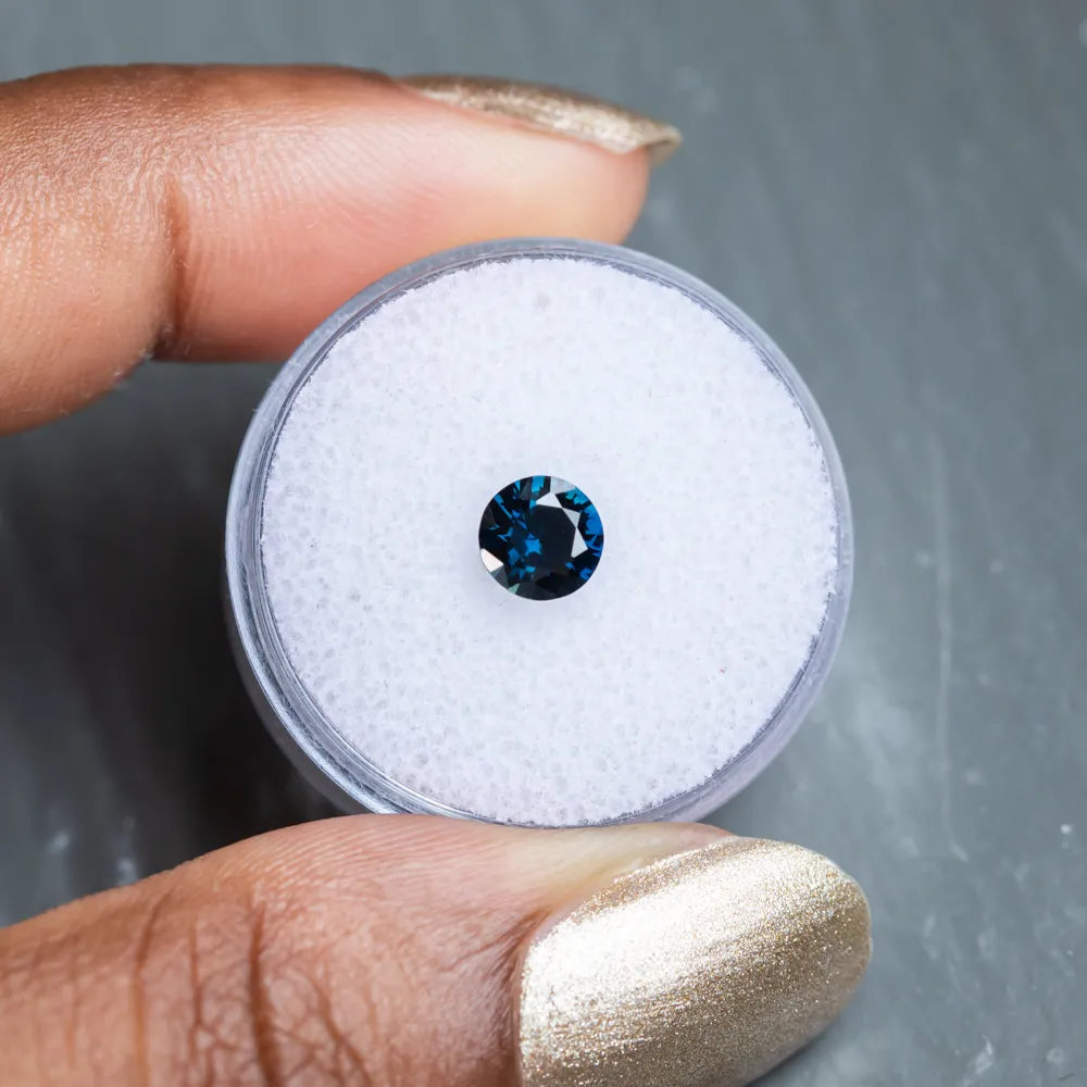 0.97CT ROUND BRILLIANT NIGERIAN SAPPHIRE, DEEP TEAL, 5.98X3.64MM, UNTREATED.